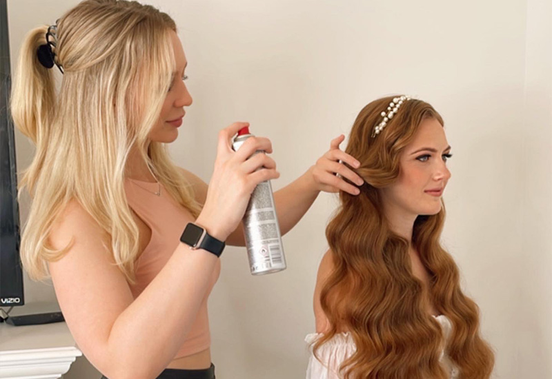 RJ Styles Co Rachel Jones - Alberta Bridal Hairstyling Lessons - Rachel hairspraying redhead bride's hair
